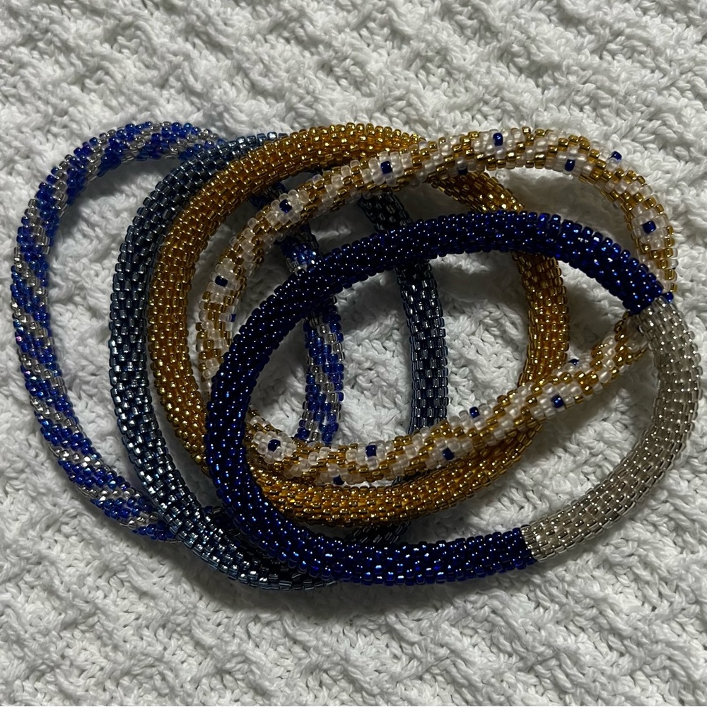 5 Sashka Co handcrafted beaded bracelets. Royal blue and gold. Approx 8”.
